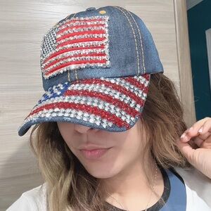 Adjustable denim cap with U.S. flag design.